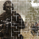 A solider walks through a field while the image is slowly destroyed.